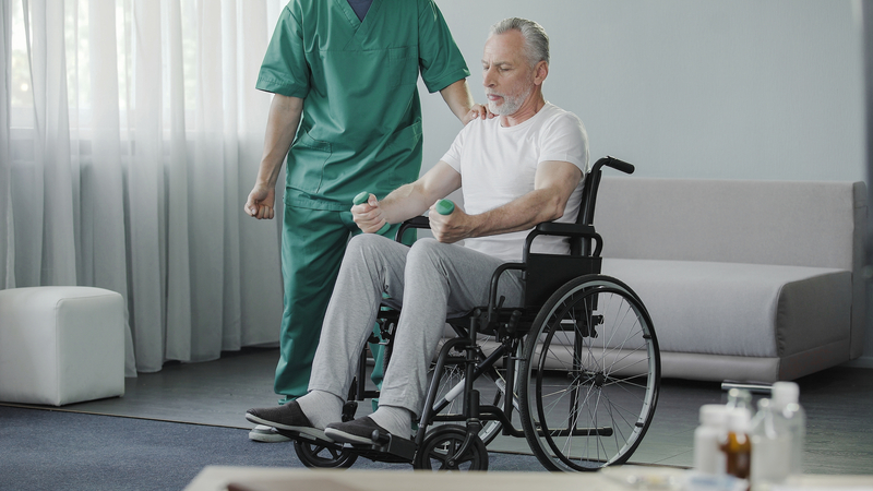 Caregiver supporting adult with disability respectfully