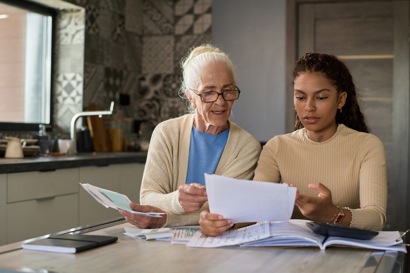 Caregiver assisting with client money management