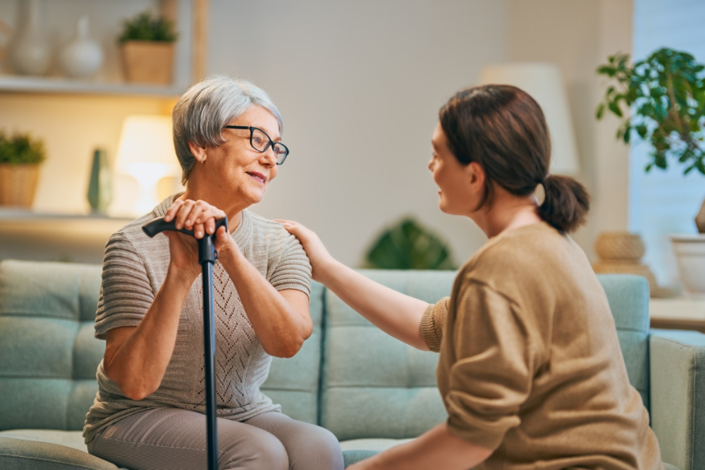 Caregiver supporting older adult with behavioral symptoms