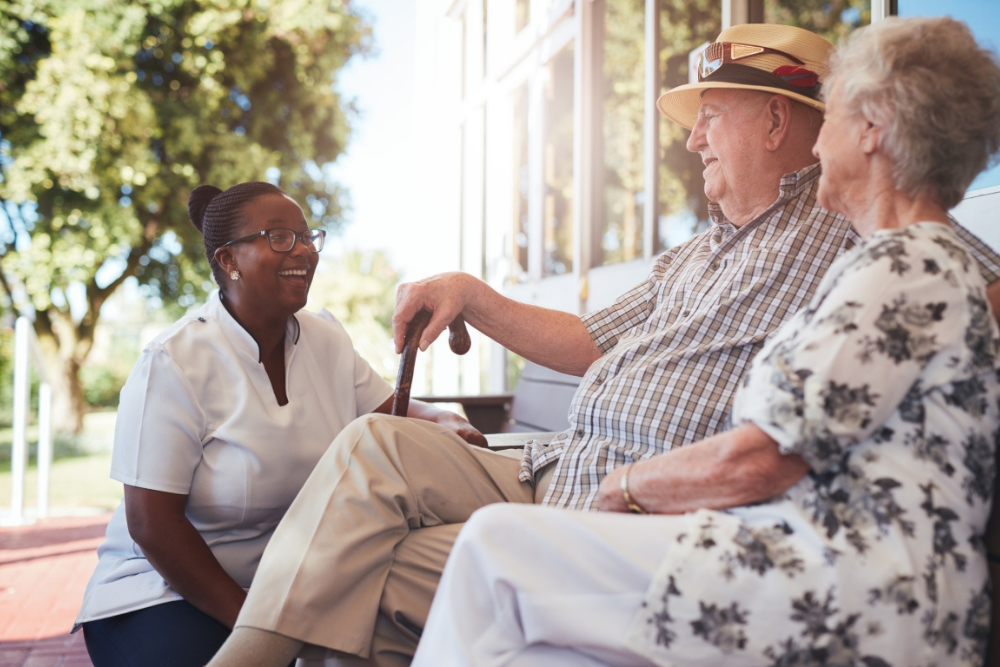 Caregiver communicating with patient’s family members